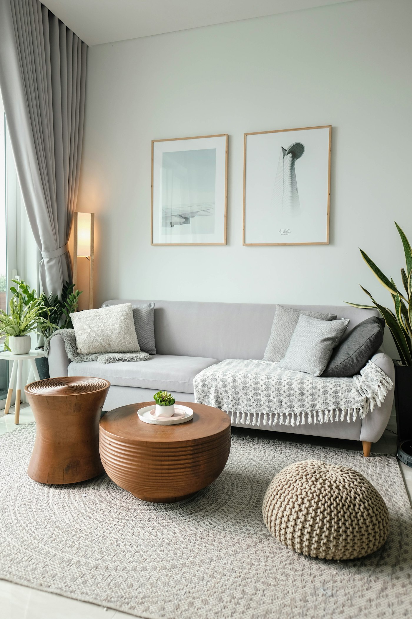 A bright living room with a large rug and upholstered seating